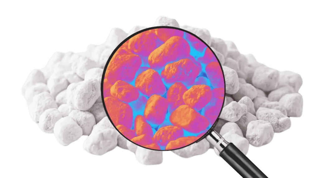 A magnifying glass hovering over a pile of incense shows that the incense looks very strange under subjection